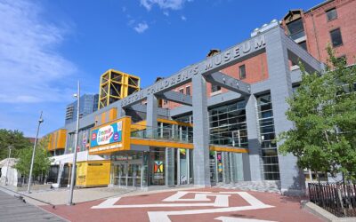 Front entrance of the Boston Children's Museum in Fort Point under a bright blue sky