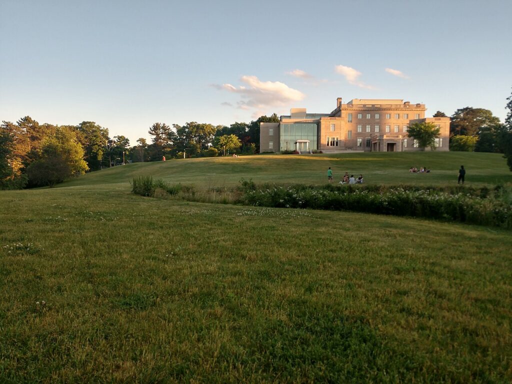 The McMullen Museum of Art and its sloping green lawn on Boston College's Brighton Campus at golden hour