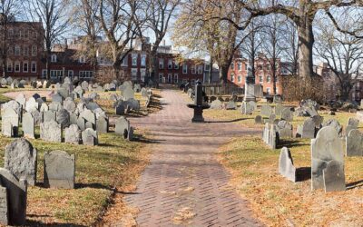 Rows of colonial-era slate headstones along the brick path through Copp's Hill Burying Ground in Boston's North End