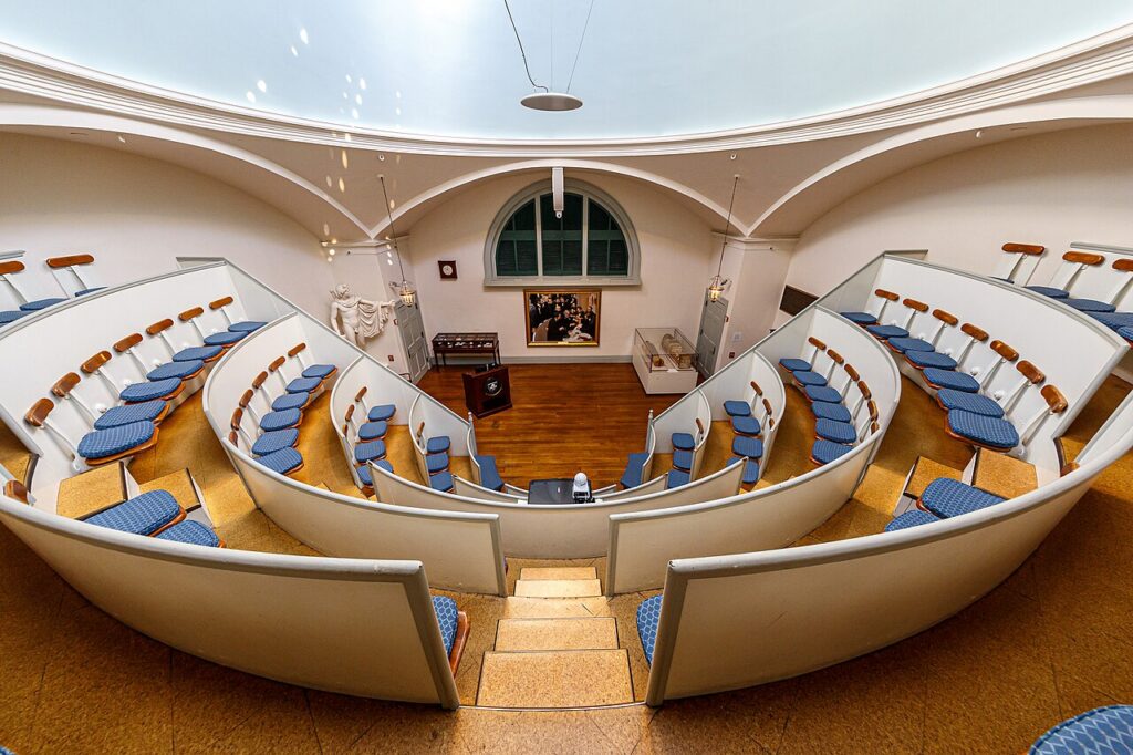 The Ether Dome surgical amphitheater at Massachusetts General Hospital, with tiered seating curving beneath the skylit dome of the Bulfinch Building