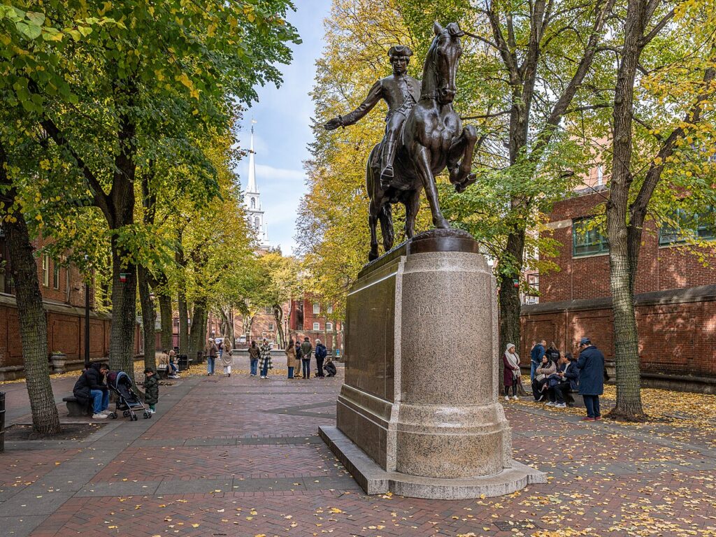 Tree-lined Paul Revere Mall (the Prado) in autumn with the Paul Revere equestrian statue and the Old North Church steeple in Boston's North End